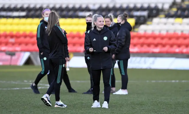 Celtic's players check out the Firhill surface pre-match