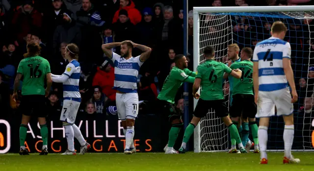 Charlie Austin holds his head after missing a penalty