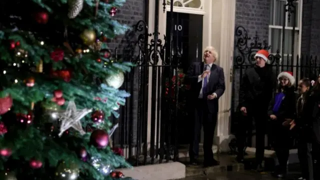 UK Prime Minister Boris Johnson (centre) outside No 10 Downing Street for the Christmas lights switch-on. Photo: 1 December 2021