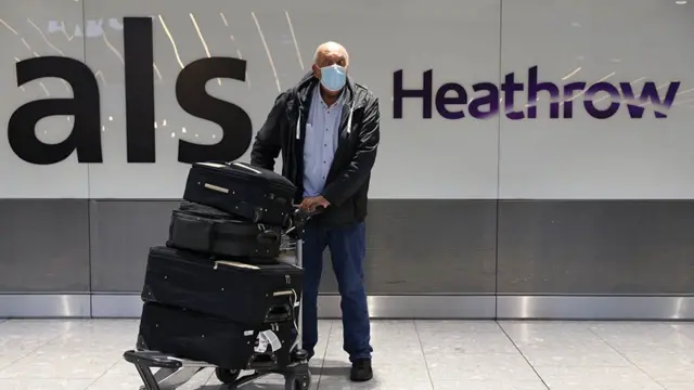 A passenger with luggage at London's Heathrow airport. File photo