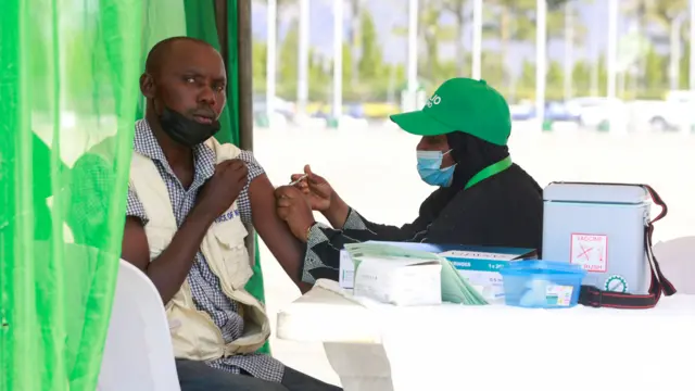 A man receives the coronavirus disease (COVID-19) vaccine during the flag-off of mass vaccination of COVID-19 campaign in Abuja, Nigeria, November 19, 2021.