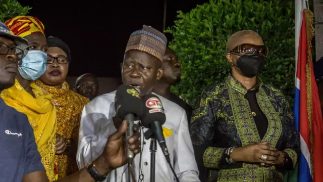 Ousainou Darboe, opposition leader and presidential candidate for the United Democratic Party (UDP), speaking to supporters outside his home. Ousainou Darboe rejects the results of the Gambia's first presidential election