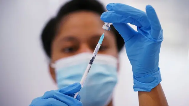 Nurse prepping jab