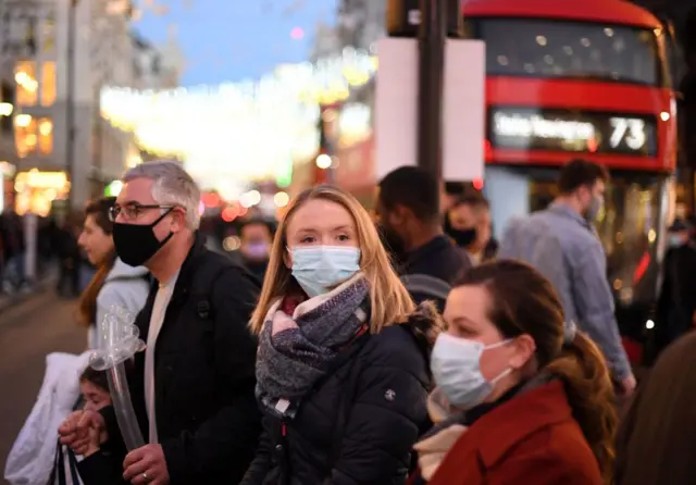 People wearing masks on a central London street