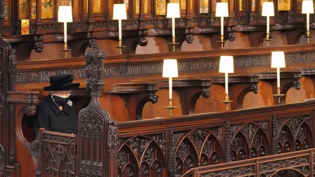 The Queen sits alone at her husband's funeral