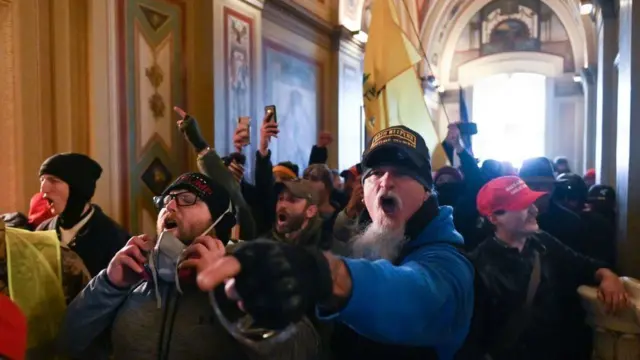 A mob of rioters on 6 January at the US Capitol