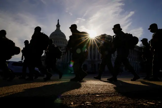 National guard members patrol the U.S. Capitol as the Senate impeachment trial against former President Donald Trump begins in Washington, U.S., February 9, 2021.