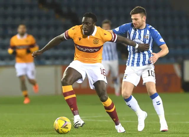 Motherwell's Bevis Mugabe in action with Greg Kiltie