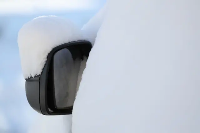 Snow covers a car wing mirror in Larbert, near Falkirk