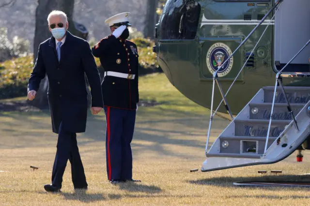 US President Joe Biden walks on the South Lawn toward the residence after he landed at the White House February 8, 2021 in Washington, DC