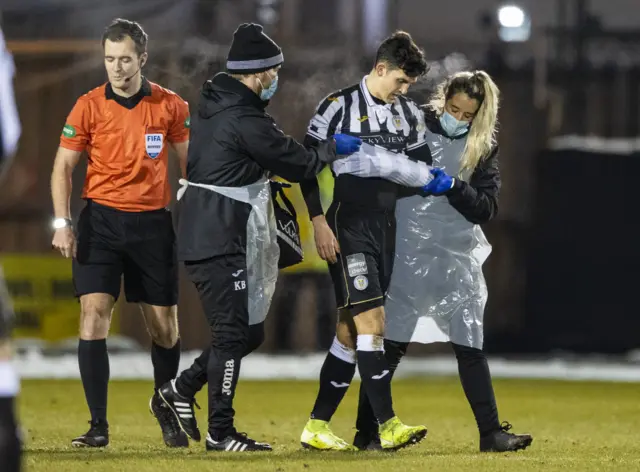 Jamie McGrath is led off the park with an injury