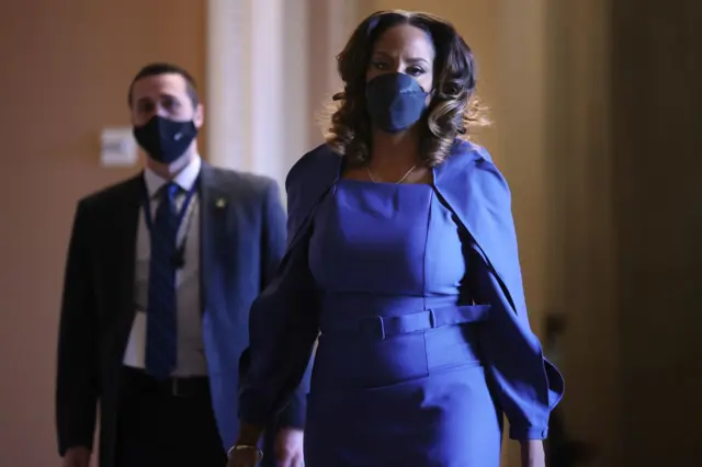 Democratic Congresswoman Stacey Plaskett walks through the Senate on 10 February 2021