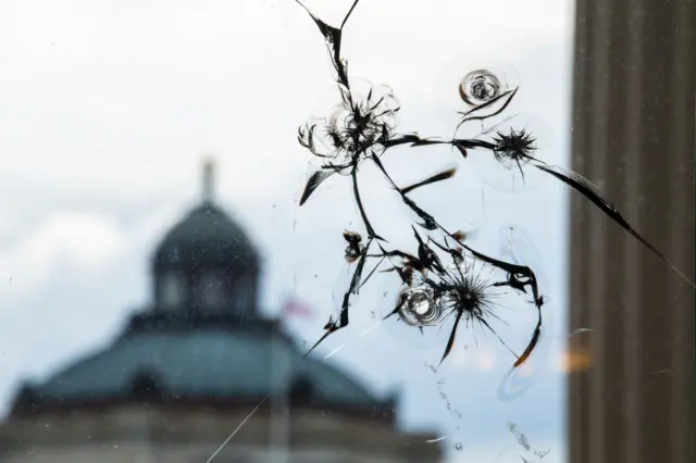 Shattered window in the Capitol complex