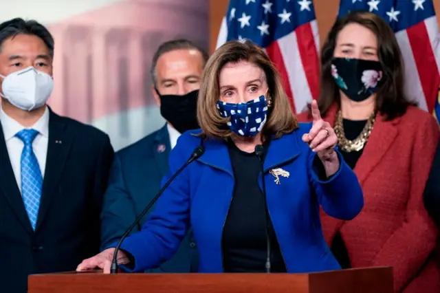 US Speaker of the House Nancy Pelosi, with House impeachment managers, speaks to the press after the Senate voted to acquit former US President Donald Trump, in the US Capitol in Washington, DC, on February 13, 2021