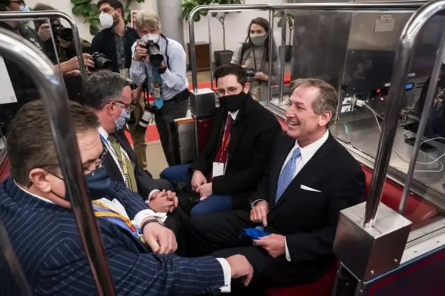 Trump's defence team, including Michael van der Veen (right) take the Senate subway post-trial