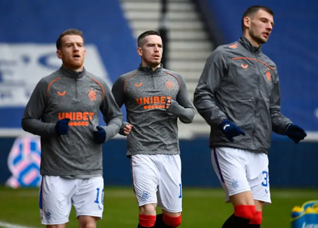 Rangers' Steven Davis and Ryan Kent warm up