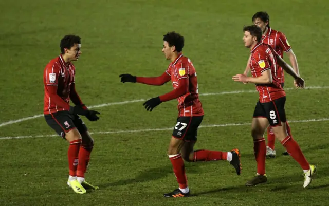 Lincoln City's Morgan Rogers celebrates scoring