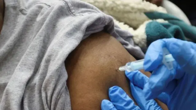 Vaccine being administered