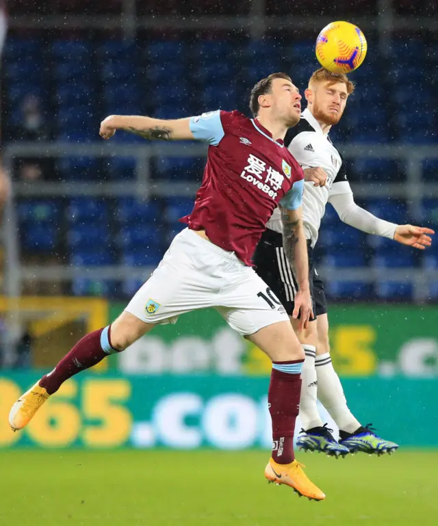 Burnley's Ashley Barnes challenges Fulham's Harrison Reed