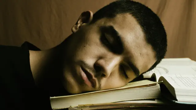 Man sleeping on a book