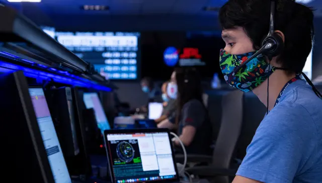 Attitude Control Systems lead Chris Pong wore a dinosaur-themed mask during a manoeuvre in September