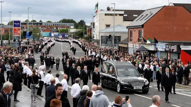 A large number of mourners turned out for Bobby Storey's funeral in west Belfast