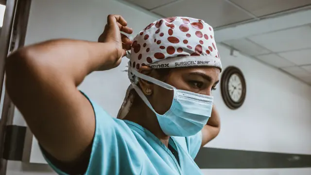 Female medic in face mask