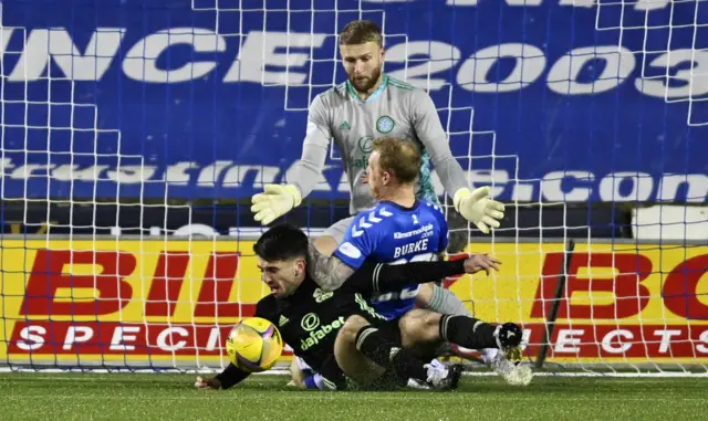 Kilmarnock's Chris Burke is thwarted by Greg Taylor