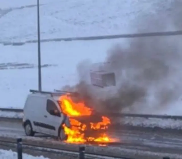 Van on fire in snow
