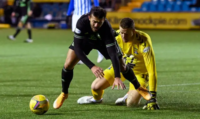 Albian Ajeti goes down under pressure from goalkeeper Colin Doyle