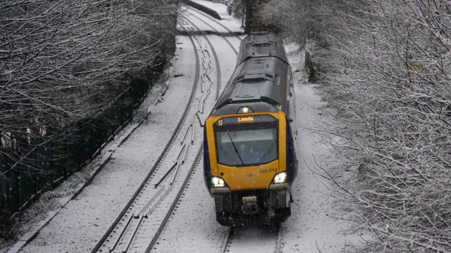 A generic picture of a train in the snow