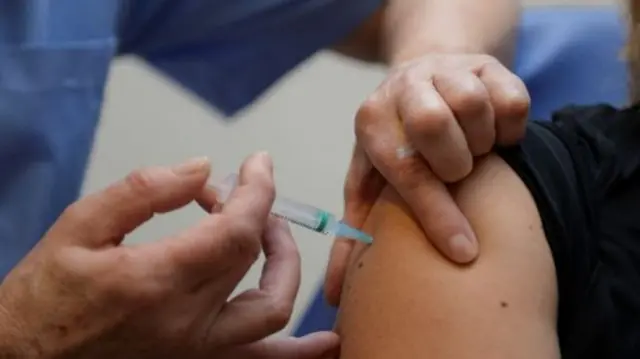 Nurse giving injection