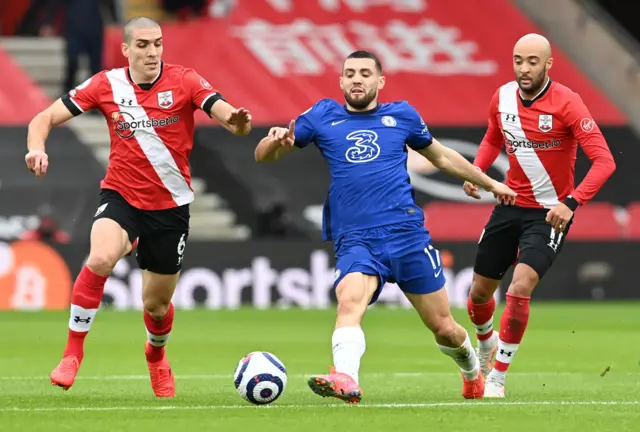 Chelsea's Mateo Kovacic in action with Southampton's Nathan Redmond and Oriol Romeu