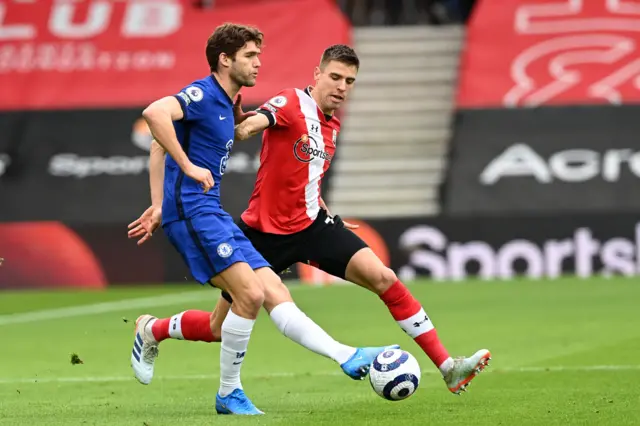 Chelsea's Spanish defender Marcos Alonso (L) vies with Southampton's Polish defender Jan Bednarek