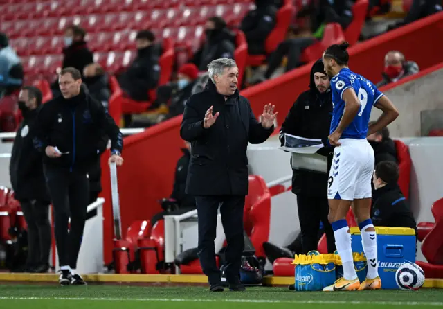 Carlo Ancelotti, Manager of Everton speaks with Dominic Calvert-Lewin