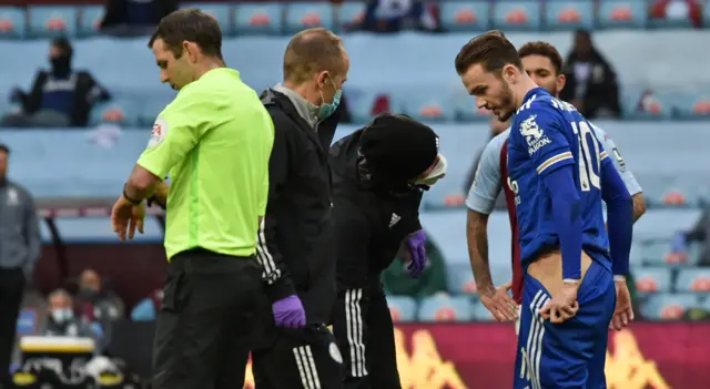 James Maddison receives treatment on a hip injury