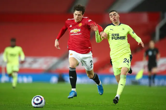 Victor Lindelof of Manchester United and Miguel Almiron