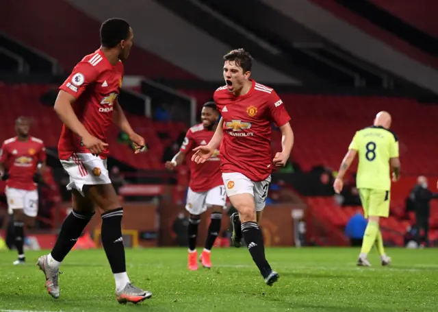 Daniel James celebrates