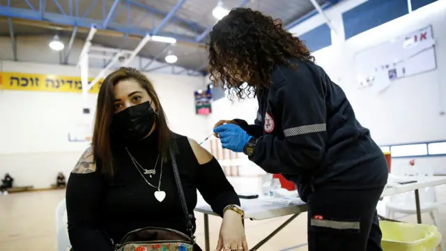 A woman having a vaccine