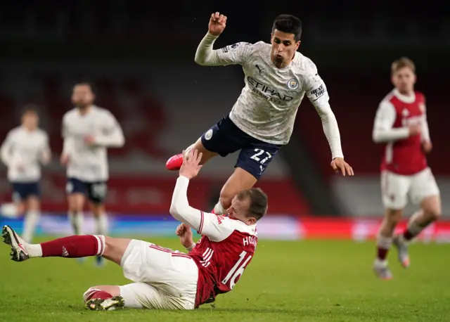 Joao Cancelo and Rob Holding