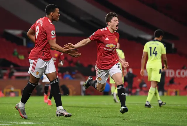 Daniel James celebrates