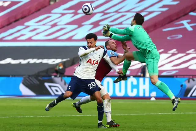 Lukasz Fabianski deals with a cross