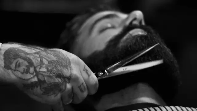 Man having his beard trimmed