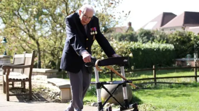 Captain Sir Tom walking to raise money