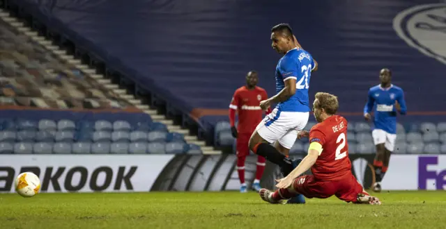 Alfredo Morelos slides the ball into an unguarded net