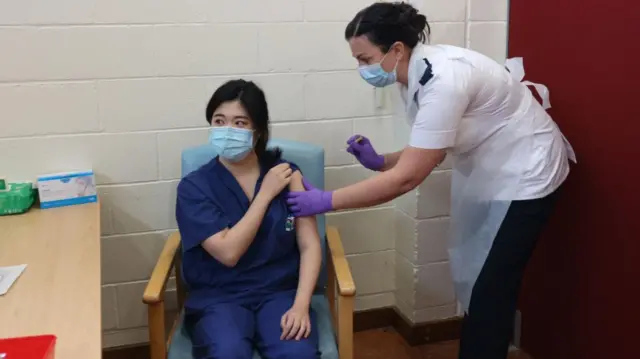 Vaccine being administered