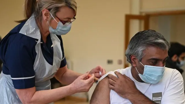 Man getting Covid-19 vaccine jab