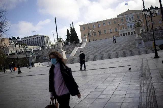 A woman wears a face mask in Athens