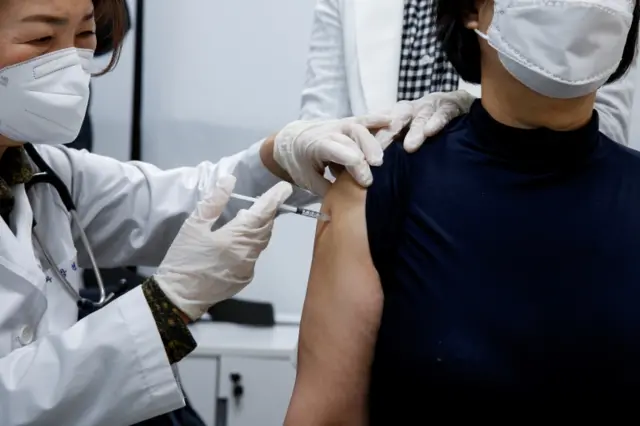 A nursing home worker receives the AstraZeneca COVID-19 vaccine at a health care centre as South Korea starts a vaccination campaign against the coronavirus disease