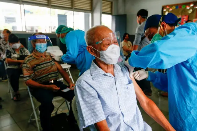 People receive their first dose of China"s Sinovac Biotech vaccine for the coronavirus disease